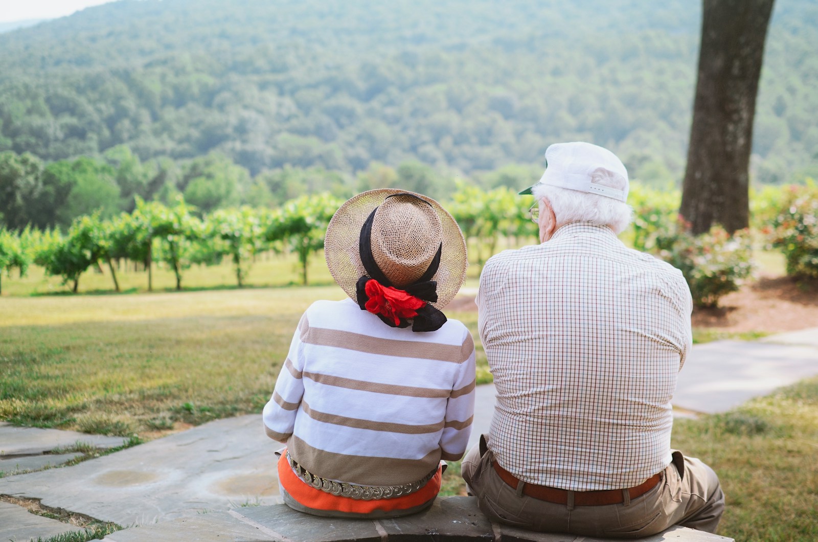 couple sitting on pathway, life